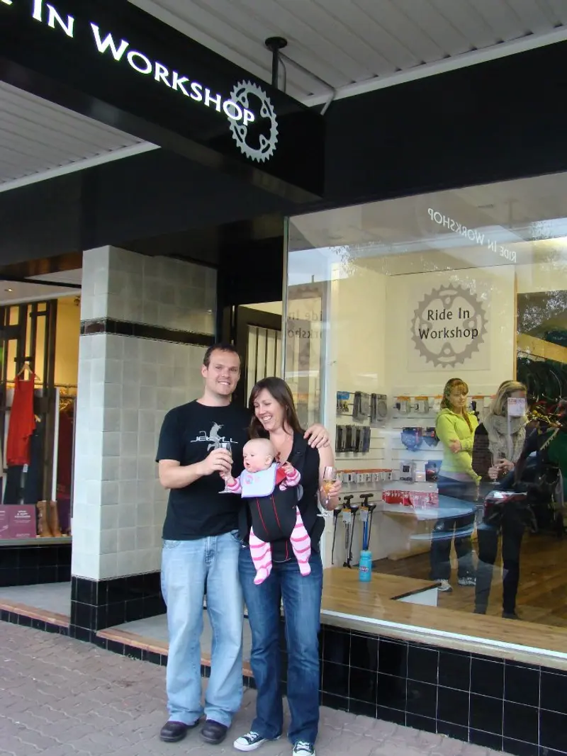Jordan Wilson with his wife and the newborn at the launch of the Ride-In Workshop in 2011. 